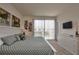Well lit main bedroom with a sliding glass door that leads to a balcony at 1523 Still Dr, Clermont, FL 34714