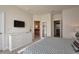 Bright and airy main bedroom featuring a mounted television and an ensuite bathroom at 1523 Still Dr, Clermont, FL 34714