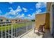 Relaxing patio with chairs overlooking green space and neighboring houses at 1523 Still Dr, Clermont, FL 34714