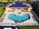 Overhead view of community pool featuring solar panels and ample lounge seating at 1523 Still Dr, Clermont, FL 34714