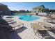 Community pool area surrounded by lots of poolside lounge chairs at 1523 Still Dr, Clermont, FL 34714