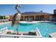Inviting community pool area featuring a striking metal heron statue and plenty of lounge seating at 1523 Still Dr, Clermont, FL 34714