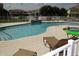 Resort-style pool with an adjacent hot tub and lots of poolside lounge chairs at 1523 Still Dr, Clermont, FL 34714
