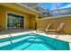 Inviting private pool area featuring comfortable lounge chairs and sun protection at 1523 Still Dr, Clermont, FL 34714