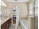 Bright bathroom with double sinks, a soaking tub and walk in shower at 1703 Leatherback Ln, St Cloud, FL 34771