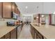 Spacious kitchen with stainless steel appliances, and a breakfast bar with pendant lighting at 1703 Leatherback Ln, St Cloud, FL 34771