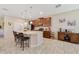 Open kitchen features stainless steel appliances, granite countertops, and ample cabinet space at 1703 Leatherback Ln, St Cloud, FL 34771