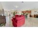 Open-concept living area with tile flooring, neutral walls, and comfortable seating at 1703 Leatherback Ln, St Cloud, FL 34771