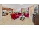 Bright open-concept space with tile floors that seamlessly connects the living and kitchen areas at 1703 Leatherback Ln, St Cloud, FL 34771
