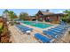 Resort-style swimming pool with comfortable lounge chairs and a covered pavilion at 1703 Leatherback Ln, St Cloud, FL 34771
