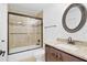 Bathroom with granite vanity, shower, and modern fixtures at 1705 Ridgemoor Dr, Mascotte, FL 34753