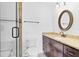 Bathroom with granite vanity, shower, and modern fixtures at 1705 Ridgemoor Dr, Mascotte, FL 34753
