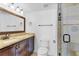 Bathroom featuring a glass enclosed shower, vanity and bronze fixtures at 1705 Ridgemoor Dr, Mascotte, FL 34753