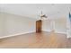 Bedroom features hardwood floors, decorative ceiling fan and a vintage style armoire at 1705 Ridgemoor Dr, Mascotte, FL 34753