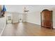 Expansive bedroom with armoire, wood-look floors, and multiple windows for ample light at 1705 Ridgemoor Dr, Mascotte, FL 34753