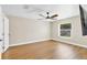 Bedroom with wood floors, neutral paint, ceiling fan and natural light at 1705 Ridgemoor Dr, Mascotte, FL 34753