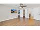 Bedroom with wood floors, ceiling fan, ensuite and walk in closet at 1705 Ridgemoor Dr, Mascotte, FL 34753