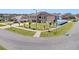 Two-story home featuring a well maintained lawn with mature landscaping and a two car garage at 1705 Ridgemoor Dr, Mascotte, FL 34753