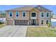 Charming two-story home featuring an attached garage, well-manicured lawn, and a welcoming double-door entrance at 1705 Ridgemoor Dr, Mascotte, FL 34753
