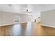 Spacious living room featuring wood floors, ceiling fan and view of the kitchen at 1705 Ridgemoor Dr, Mascotte, FL 34753