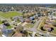 Wide aerial shot showcases a peaceful residential neighborhood with manicured lawns and mature trees at 1705 Ridgemoor Dr, Mascotte, FL 34753