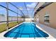 A beautiful screened-in pool with a well maintained yard at 1705 Ridgemoor Dr, Mascotte, FL 34753