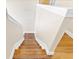 View of staircase leading to lower level with wood steps at 1705 Ridgemoor Dr, Mascotte, FL 34753