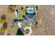 Stunning aerial view of a property featuring a pool, RV parking, circular driveway, and solar panels on the roof at 17117 Heartwood Loop, Winter Garden, FL 34787