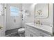 Bright bathroom featuring glass shower, gold fixtures, and stylish decor at 17117 Heartwood Loop, Winter Garden, FL 34787