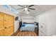 Lofted bedroom with ample natural light, sleek ceiling fan, and modern murphy bed at 17117 Heartwood Loop, Winter Garden, FL 34787