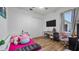 Cozy bedroom with desk, plush decor, and window, perfect for a  at 17117 Heartwood Loop, Winter Garden, FL 34787