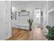 Inviting entryway with coat rack, plant, and archway leading to a bathroom at 17117 Heartwood Loop, Winter Garden, FL 34787