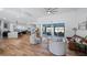 Expansive living area with modern furnishings, hardwood floors, and sliding doors to the outdoor space and views at 17117 Heartwood Loop, Winter Garden, FL 34787