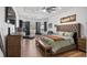 Spacious primary suite with natural light, seating area, walk-in closet, and modern decor at 17117 Heartwood Loop, Winter Garden, FL 34787