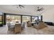 Covered outdoor patio with tile floors, a ceiling fan and a view of the backyard at 17117 Heartwood Loop, Winter Garden, FL 34787
