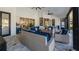 Spacious covered patio with outdoor seating, ceiling fans, and views of lush landscaping at 17117 Heartwood Loop, Winter Garden, FL 34787
