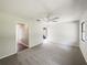 Spacious bedroom with neutral carpet, ceiling fan, and natural light at 1738 Athens Ct, Lakeland, FL 33803