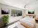 Bright bedroom with a large window, neutral paint, ceiling fan, and natural light at 1738 Athens Ct, Lakeland, FL 33803