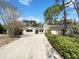 Charming single-story home with a large front yard and a long driveway leading to an attached garage at 1738 Athens Ct, Lakeland, FL 33803