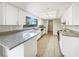Bright kitchen featuring granite countertops, stainless steel appliances, and ample cabinet space for storage at 1738 Athens Ct, Lakeland, FL 33803