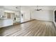 Bright living room with vaulted ceilings, hardwood floors, and an open floor plan that flows into the kitchen at 1738 Athens Ct, Lakeland, FL 33803
