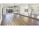 Open floor plan featuring new wood flooring, bright light and big windows in the living room at 1738 Athens Ct, Lakeland, FL 33803