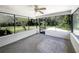 Screened porch with a view of the backyard and mature trees at 1738 Athens Ct, Lakeland, FL 33803