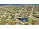 Expansive aerial view highlighting the home's location amongst lakes and mature trees at 1943 Wingfield Dr, Longwood, FL 32779