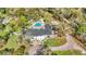 Aerial view of a luxury estate featuring a pool, spa, and expansive grounds at 1943 Wingfield Dr, Longwood, FL 32779