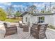 Cozy outdoor patio with brick pavers and wicker seating, offering a relaxing space with a patio heater at 1943 Wingfield Dr, Longwood, FL 32779