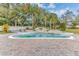 Backyard pool with rock waterfall feature and lush landscaping at 1943 Wingfield Dr, Longwood, FL 32779
