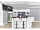 Entertaining bar featuring bar seating, a wet bar, glass shelving, a display refrigerator, and modern lighting at 1943 Wingfield Dr, Longwood, FL 32779
