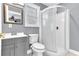 This bathroom has gray walls, white finishes, and a standing shower at 1943 Wingfield Dr, Longwood, FL 32779