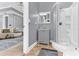 Modern bathroom featuring a stand-up shower, vanity with mirror, and views to the adjacent living room at 1943 Wingfield Dr, Longwood, FL 32779
